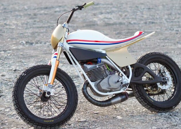 A motorcycle that displays carbon fiber and 3D printed titanium rear swingarm