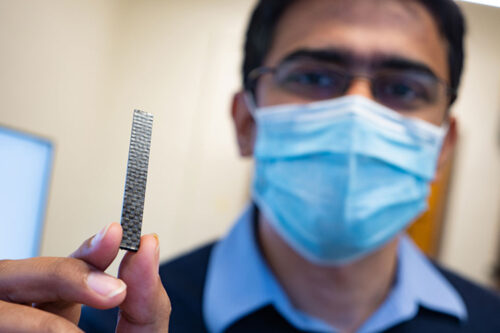 Vashisth used atomic-scale simulation software (seen on the monitors in the background) to help understand the underlying mechanics of the healable vitrimer. Photo by Andy Freeberg / University of Washington