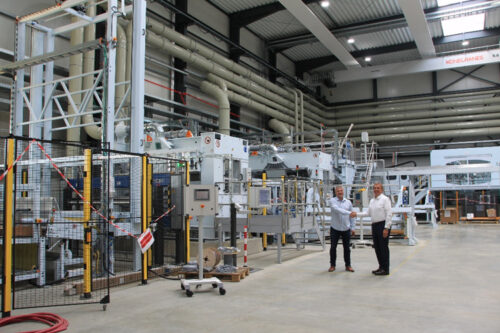 MCAM´s new high-volume KyronTEX ® production line in Heinsberg, Germany Fltr: Rolf Dothagen, Head of Sales for Composite, MCAM and Dr. Michael Effing, Founder and CEO of AMAC GmbH