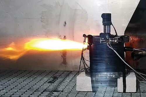 Cell thermal runaway testing in a composite casing, showing flames exiting the casing through the vent