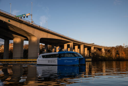 The Candela P-12 Nova under a bridge