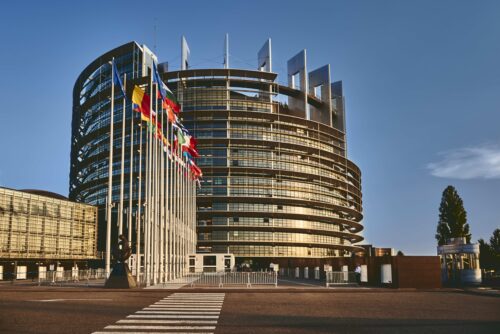 European Parliament building in Strasbourg, France with a clear blue sky in the background